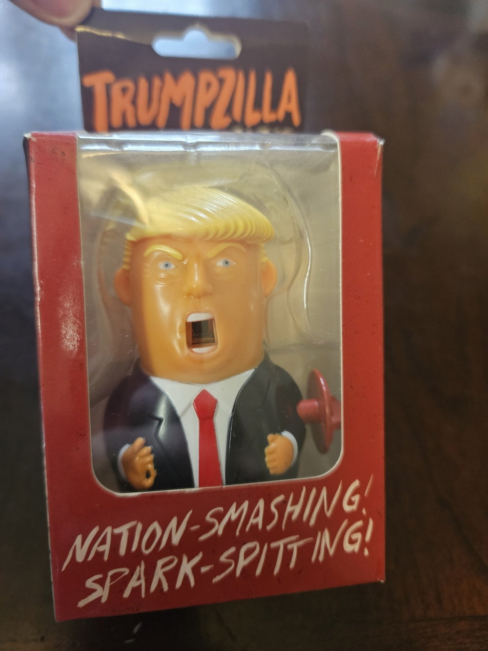 Novelty Orange and Black Figure Toy - Trumpzilla Spark-Spitting Wind Up Toy
